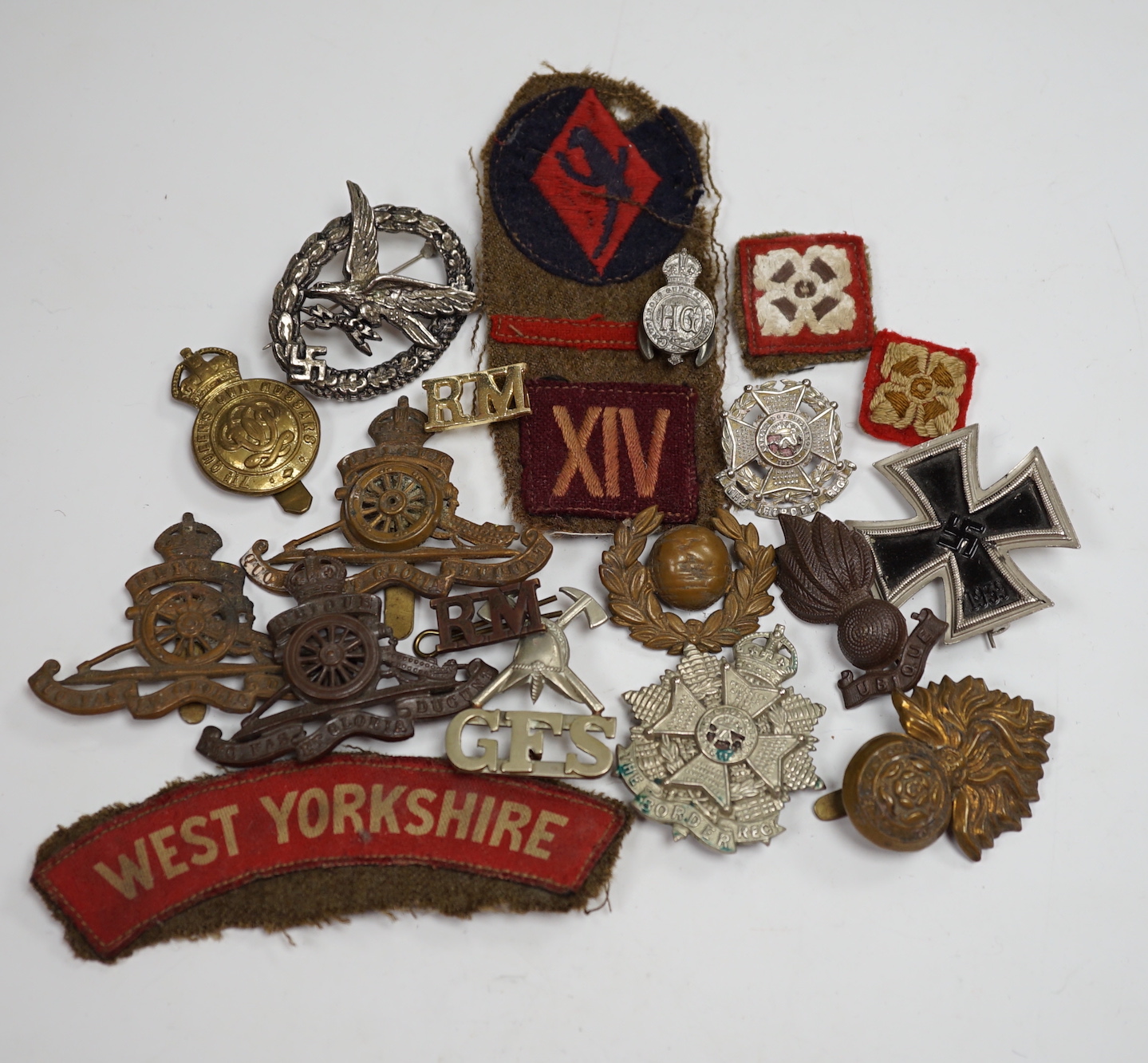 Three books on The Coldstream Guards 1914-18, Ross of Bladensburg, vols I and II and maps, together with a collection of cap badges, cloth shoulder titles, etc.